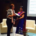 Daphne Pillai receiving the token and appreciation letter